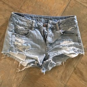 Mid-waist distressed denim shorts